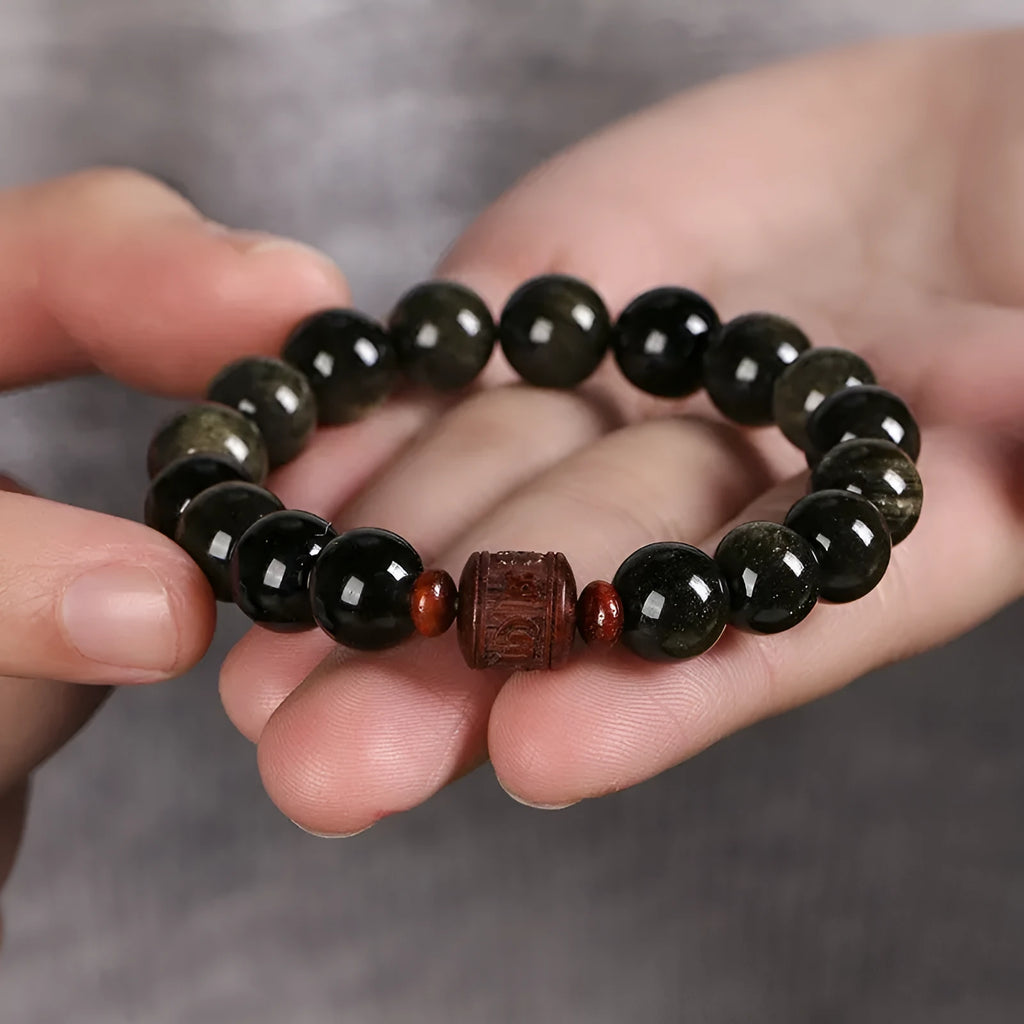 Hand-woven golden obsidian bracelet with 10mm round beads in a vintage style.