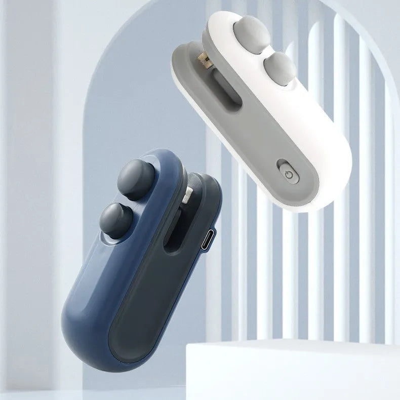 White handheld vacuum sealing machine with USB charging port and magnetic back for chip bags