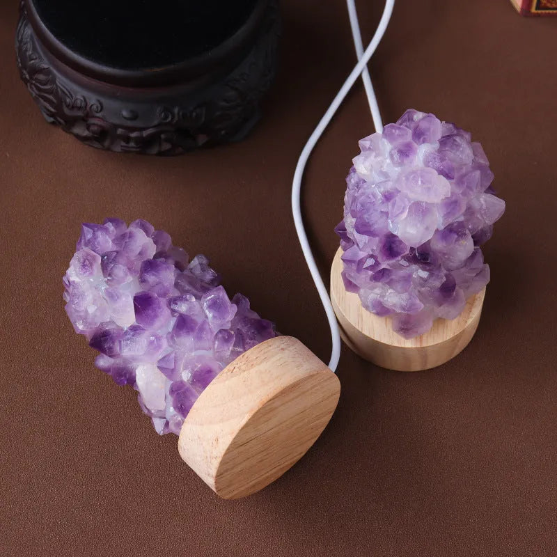 Natural amethyst crystal night light with USB plug showing both warm and cold light settings