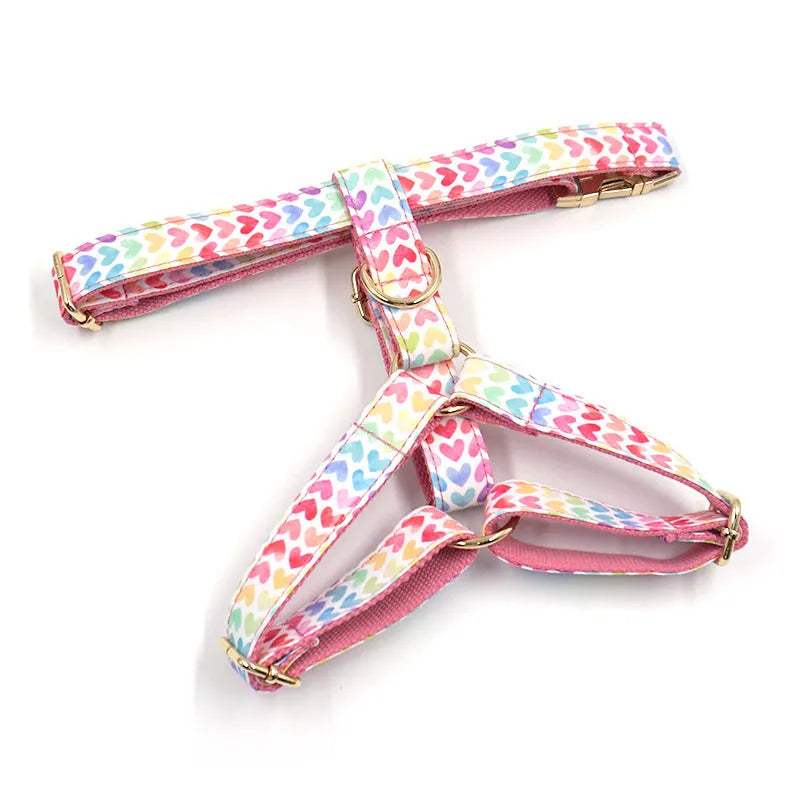 Pink colourful dog harness with gold buckle and heart-shaped stone decoration
