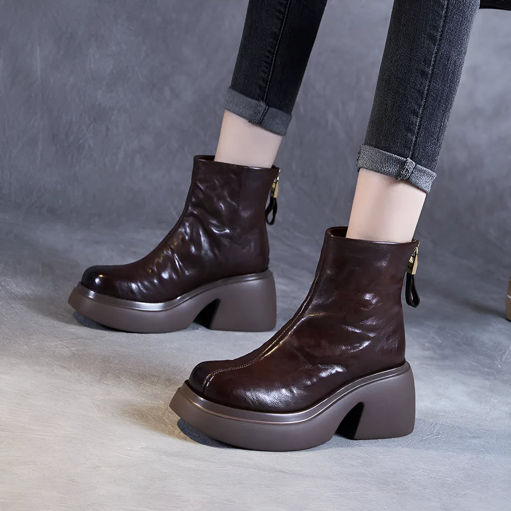Women's chunky heel ankle boots in black with thick bottom, rubber outsole, and cotton cowhide upper