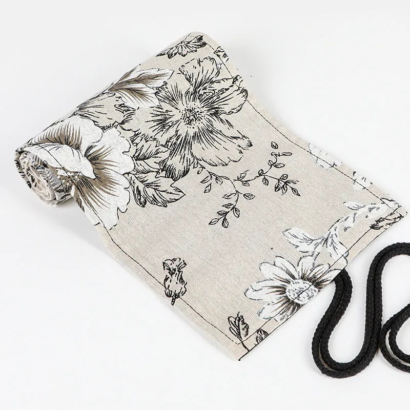 Black Peony printed canvas pencil roll bag open to show 72 holes for pens and pencils