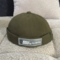Cotton baseball cap with letter pattern and rivet details, adjustable no brim, seasonal wear