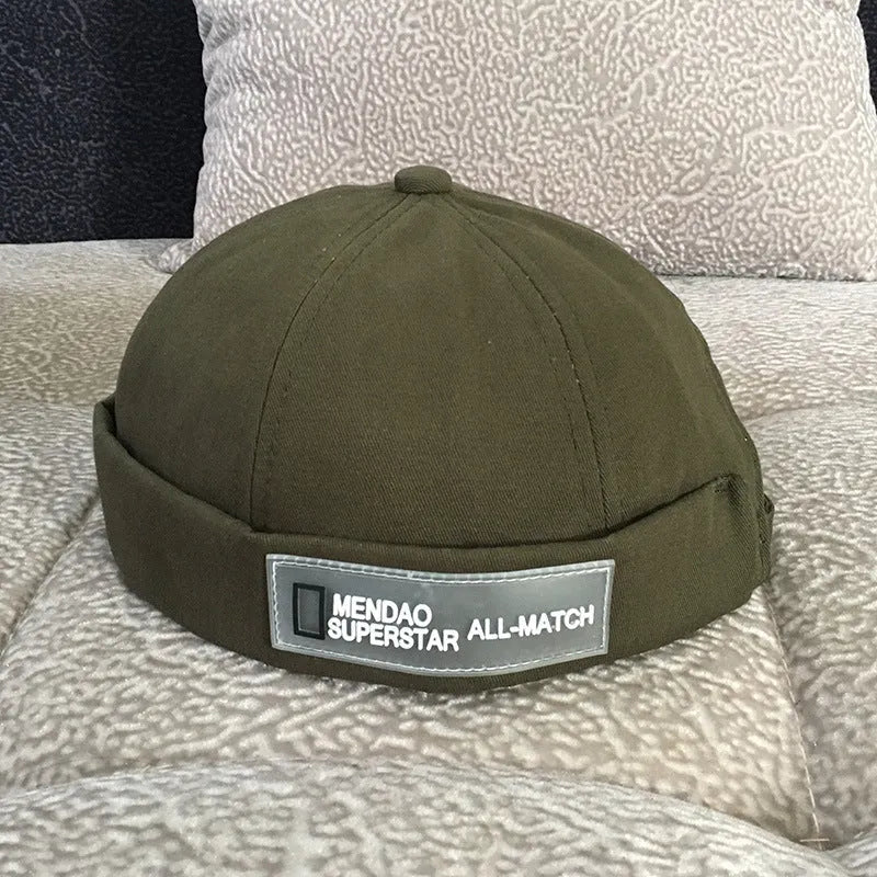 Cotton baseball cap with letter pattern and rivet details, adjustable no brim, seasonal wear