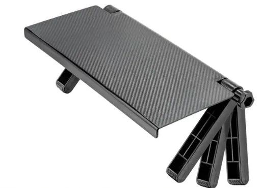 Black adjustable screen top shelf mounted on a monitor holding a streaming device and remote