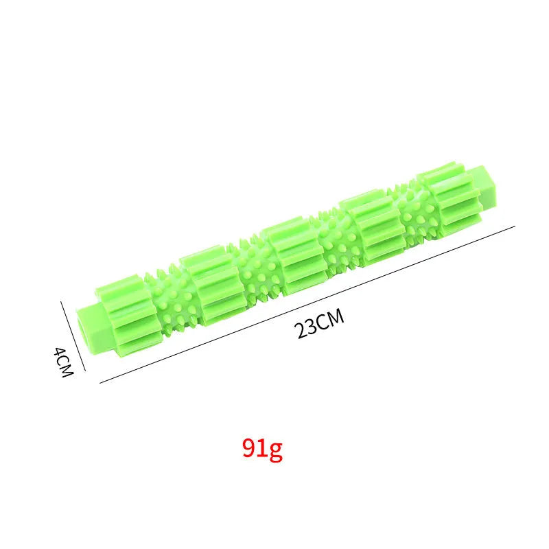 Green and orange rubber dog chew toy with treat dispensing hole and textured surface
