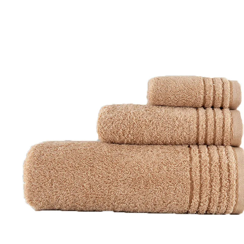 Cotton towel set in beige and brown showing three different sizes including large bath towel
