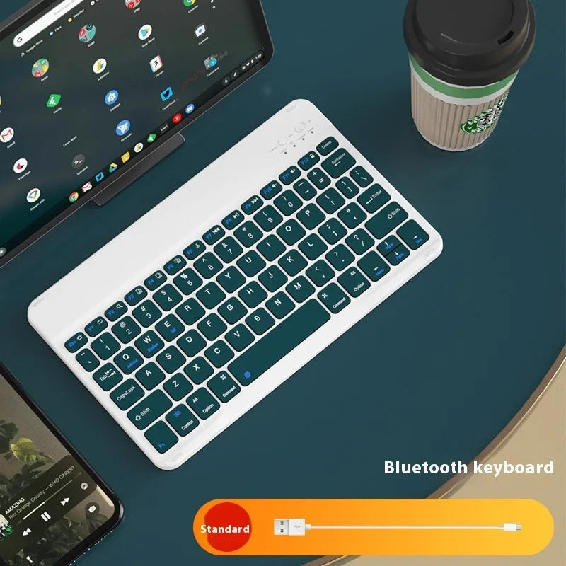 Girls Bluetooth keyboard in Lavender colour on a desk next to a tablet