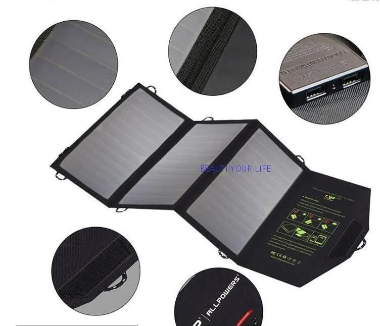 Black foldable solar panel charger with dual USB ports, shown unfolded with mounting loops