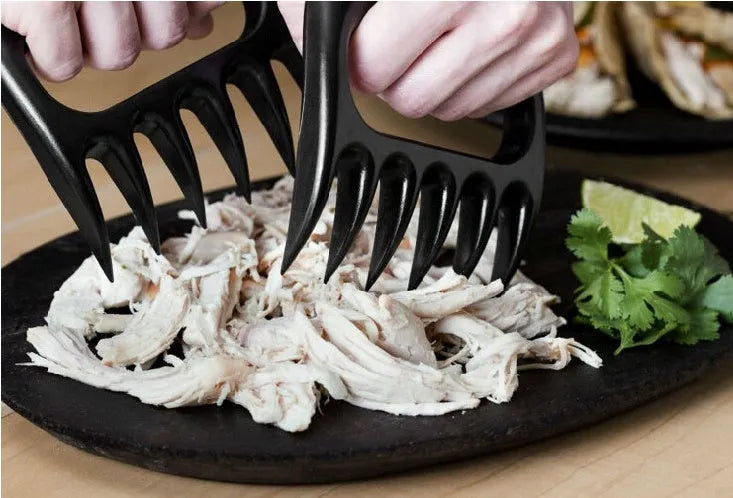 Black bear claw meat shredder fork for barbecue and kitchen use with decorative patterns.