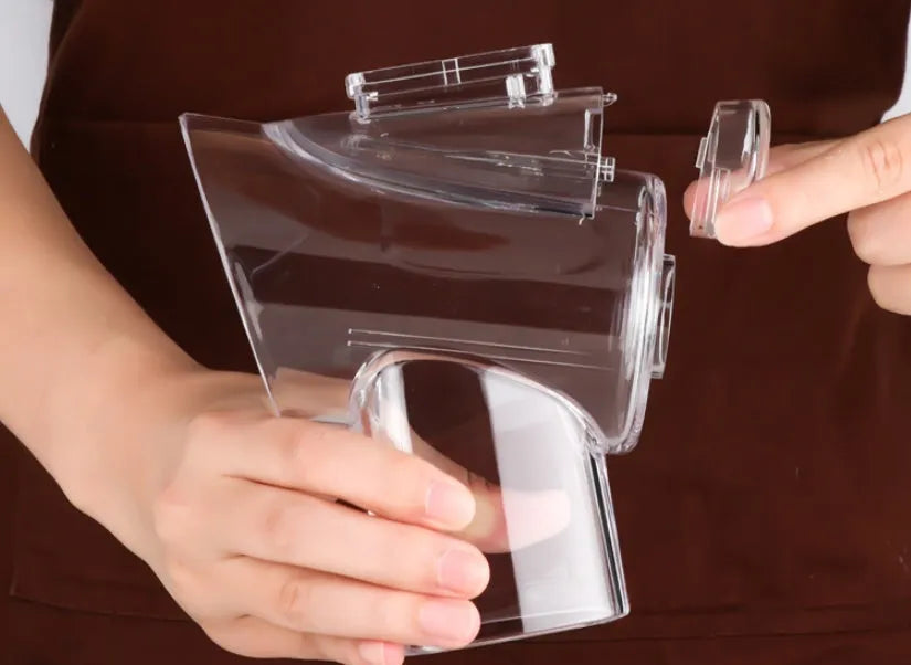 Blue manual mandoline vegetable slicer with stainless steel blade on a kitchen counter.
