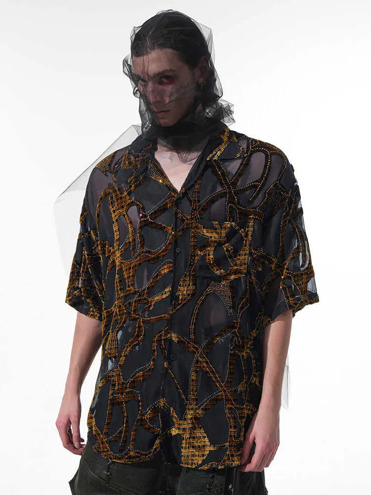 Man's loose fit short-sleeved shirt with translucent snake pattern in black or grey.