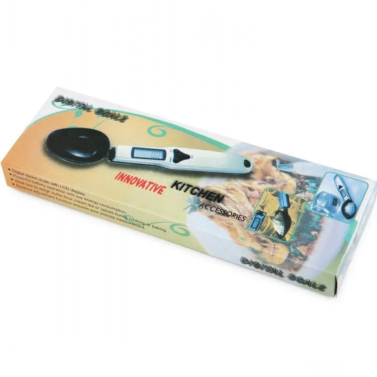 Smart digital measuring spoon with integrated display showing weight, next to AAA batteries.