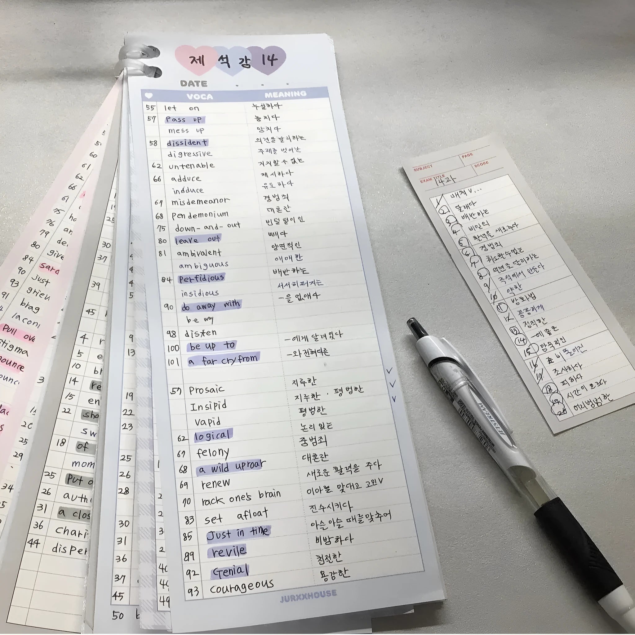 Vertical format English vocabulary notepad in B5 half size showing pink cover and double-sided printed pages
