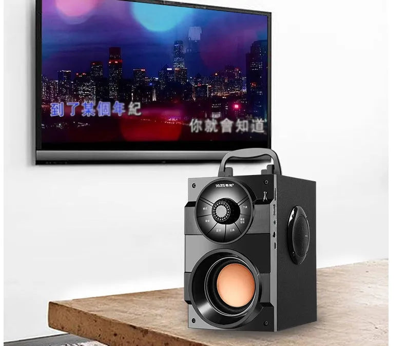 Black portable mini home audio system with subwoofer and 3.5mm audio cable