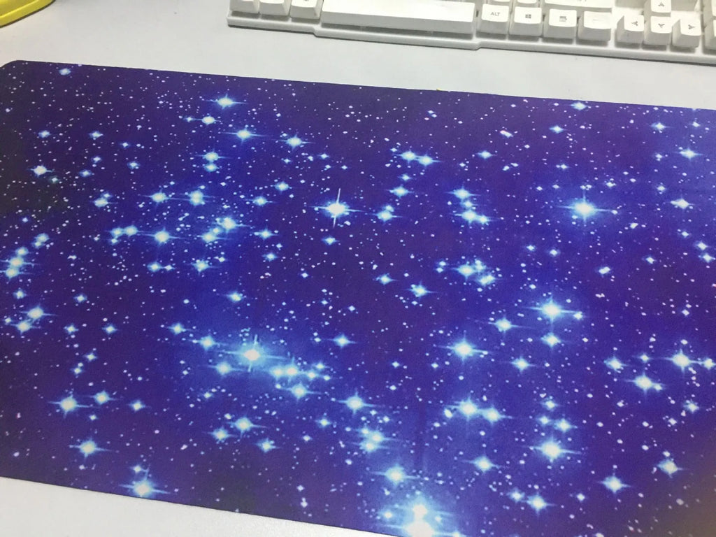 Blue star mouse pad with high-density fabric surface and natural rubber anti-skid base on a desk
