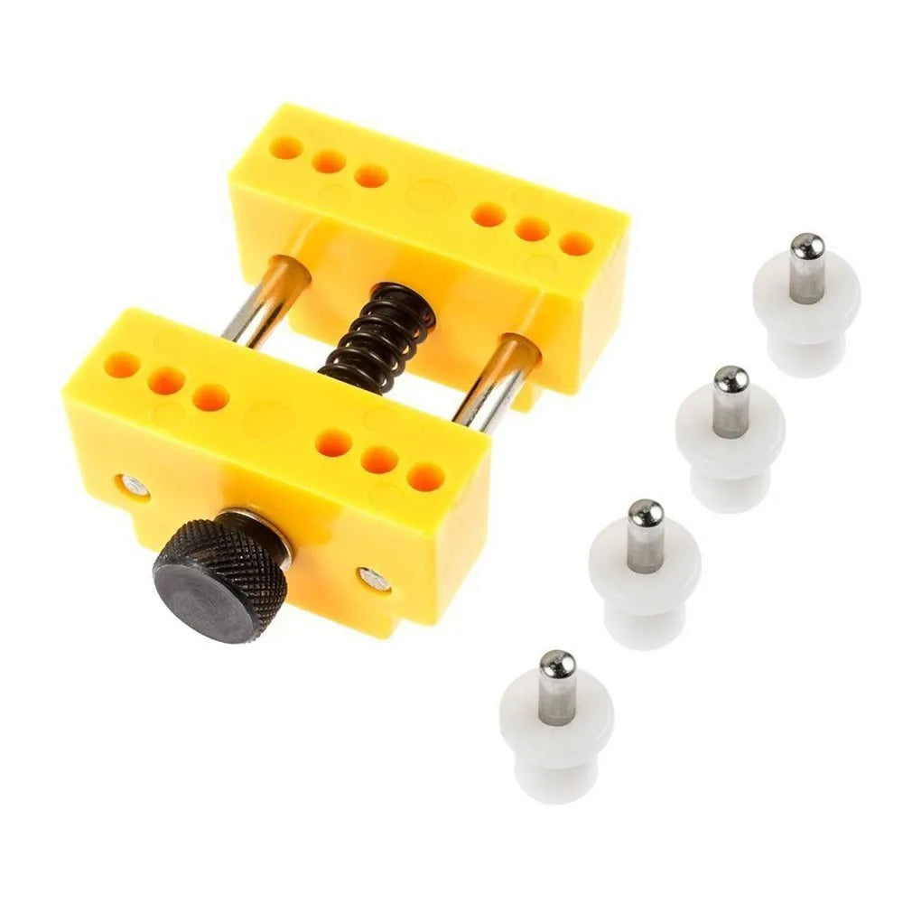 Yellow plastic watch repair case opener kit with mounting base and four positioning pillars