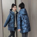 A women's loose-fit hooded winter jacket in a polyester blend, available in black, blue, green, and champagne.
