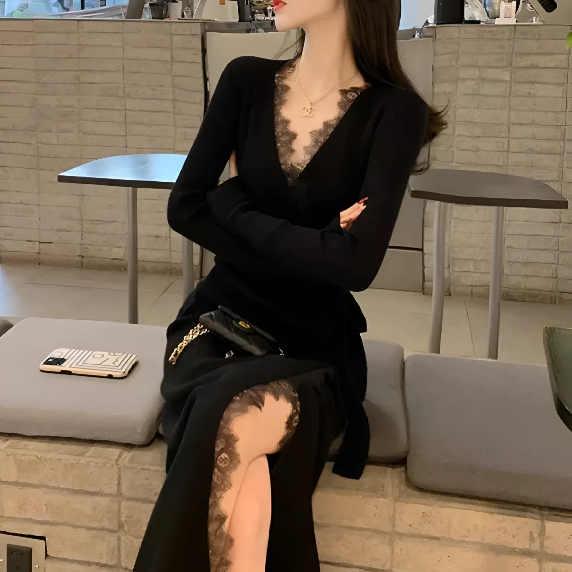Black women's slim fit woolen skirt with a princess dress silhouette on a hanger.