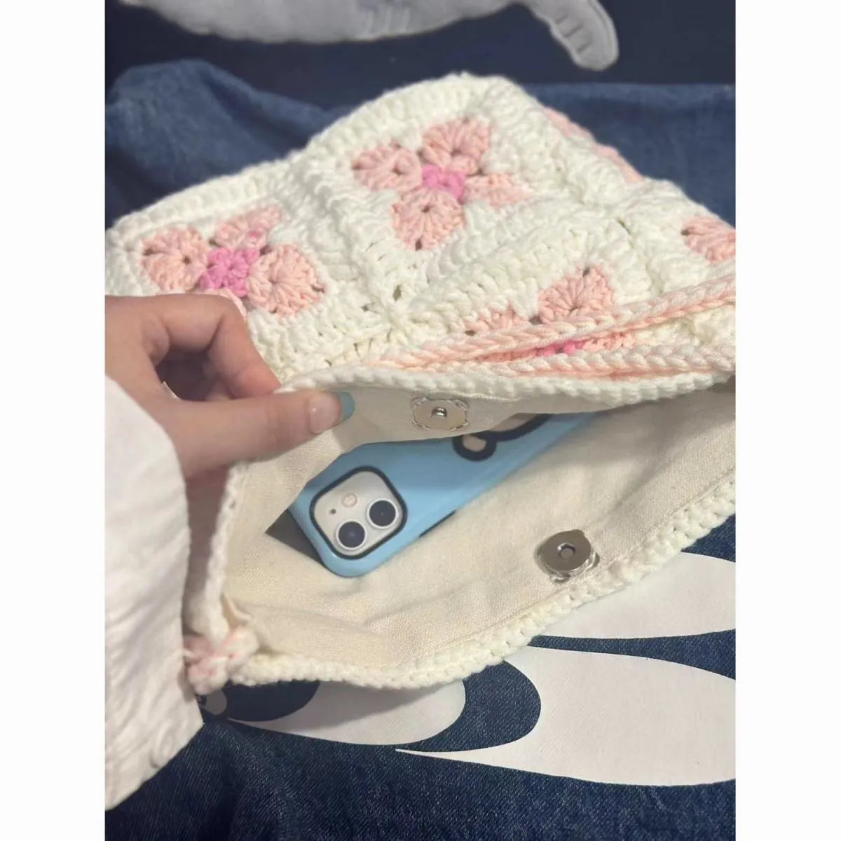Handmade cotton crochet handbag with pink cherry blossom design and magnetic buckle