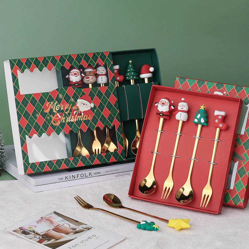 Red stainless steel Christmas spoons and forks with snowman, tree, and Santa handle designs.