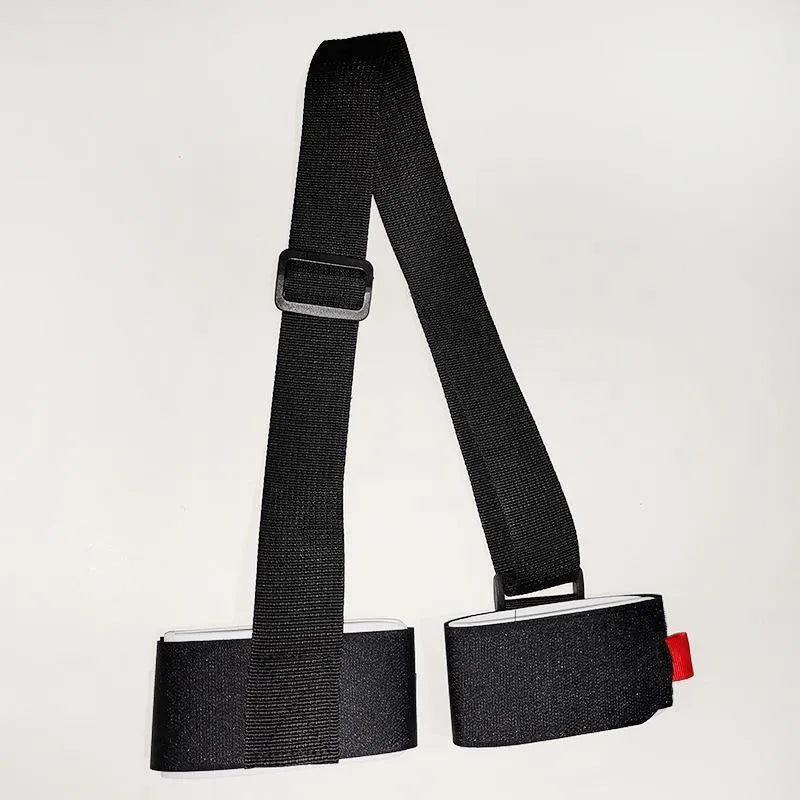 Adjustable black skiing bandage shoulder strap with hook and loop fastening for sled carrying.
