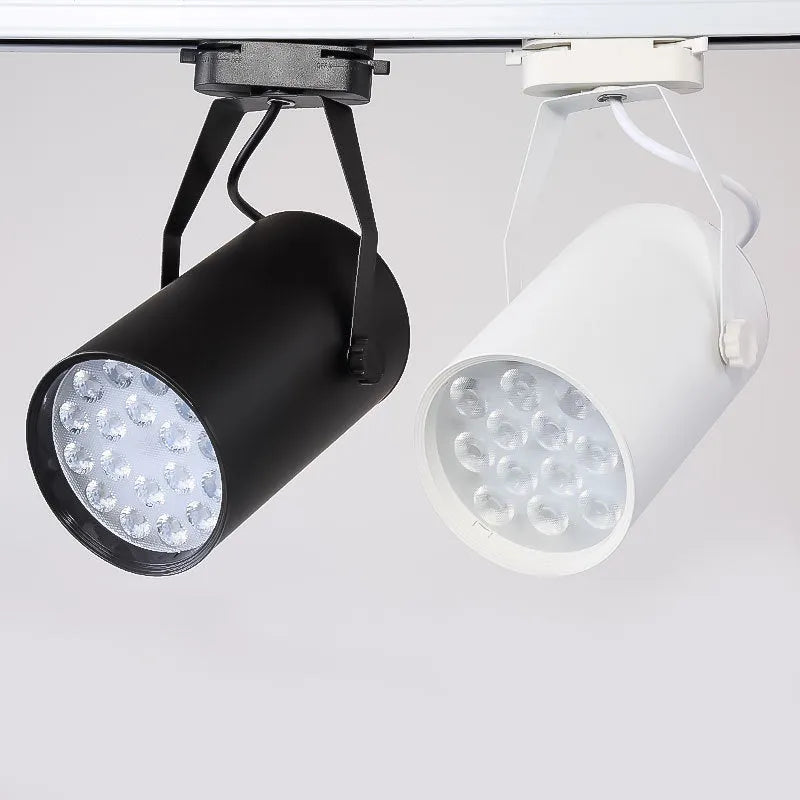 LED track spotlight with aluminium shell in black or white, available in 7W 12W 18W power outputs with warm yellow neutral white light options