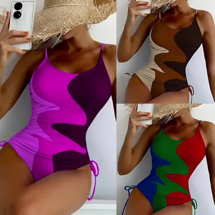 Women's sleeveless one-piece swimsuit in blue with striped pattern, backless design.