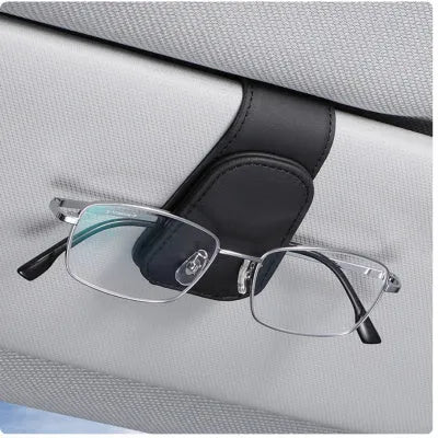Car sunglasses clip holder made from PU leather in various colours, clipped to a sun visor.
