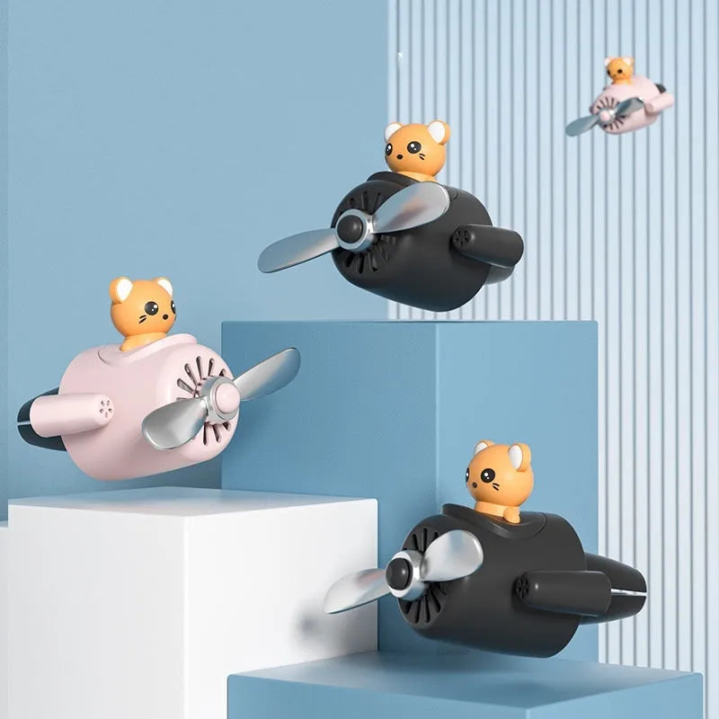 Cartoon airplane-shaped plastic car air vent clip with aromatherapy function in four colours.