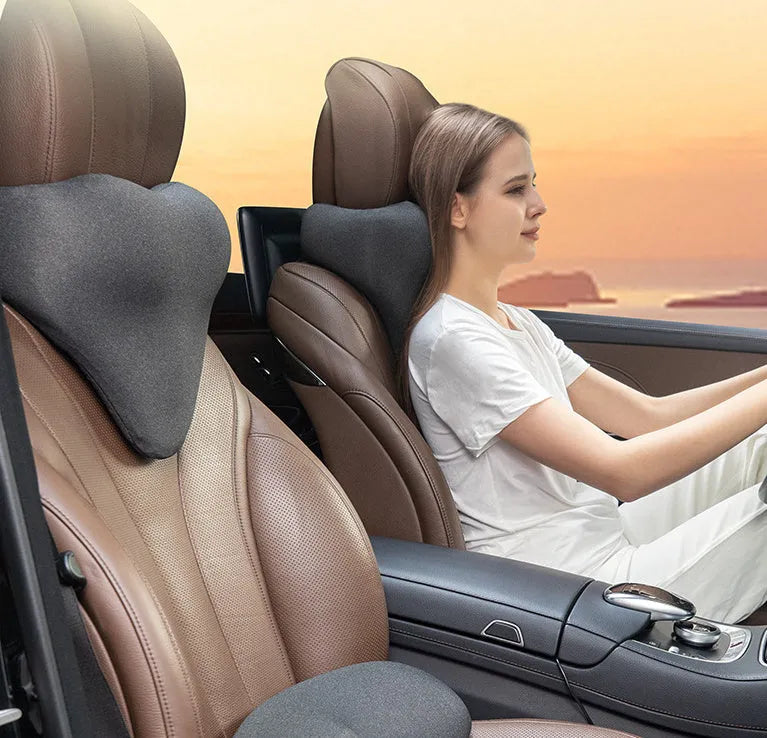 Memory foam car neck pillow in dark grey colour showing U-shaped design for automotive headrest support