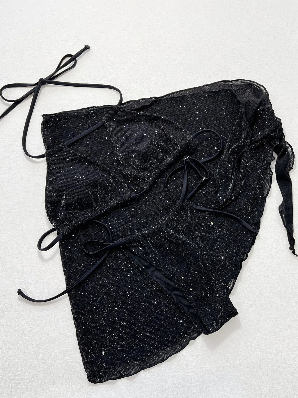 Black three-piece swimsuit bikini set with adjustable top and matching shorts