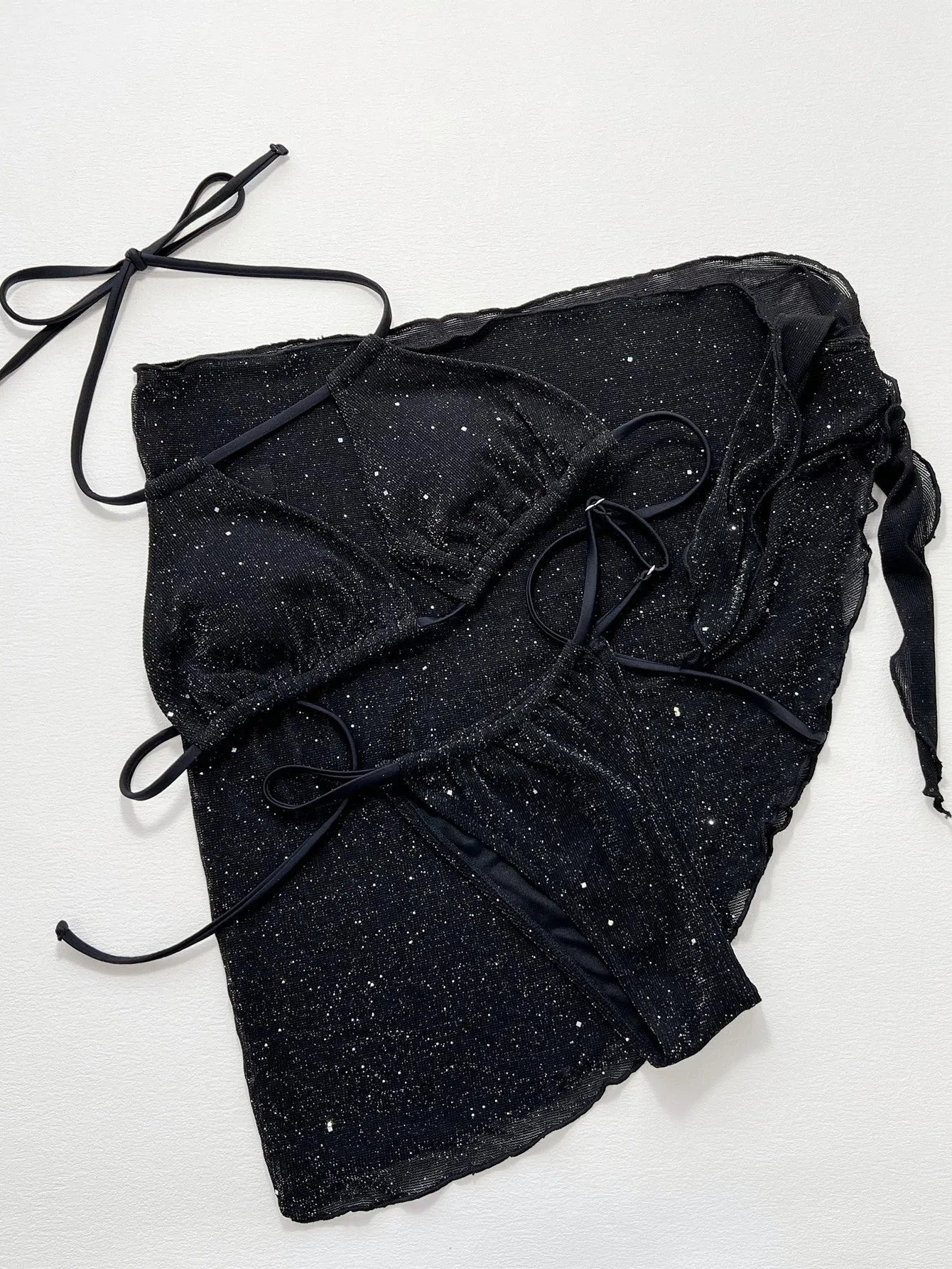 Black three-piece swimsuit bikini set with adjustable top and matching shorts