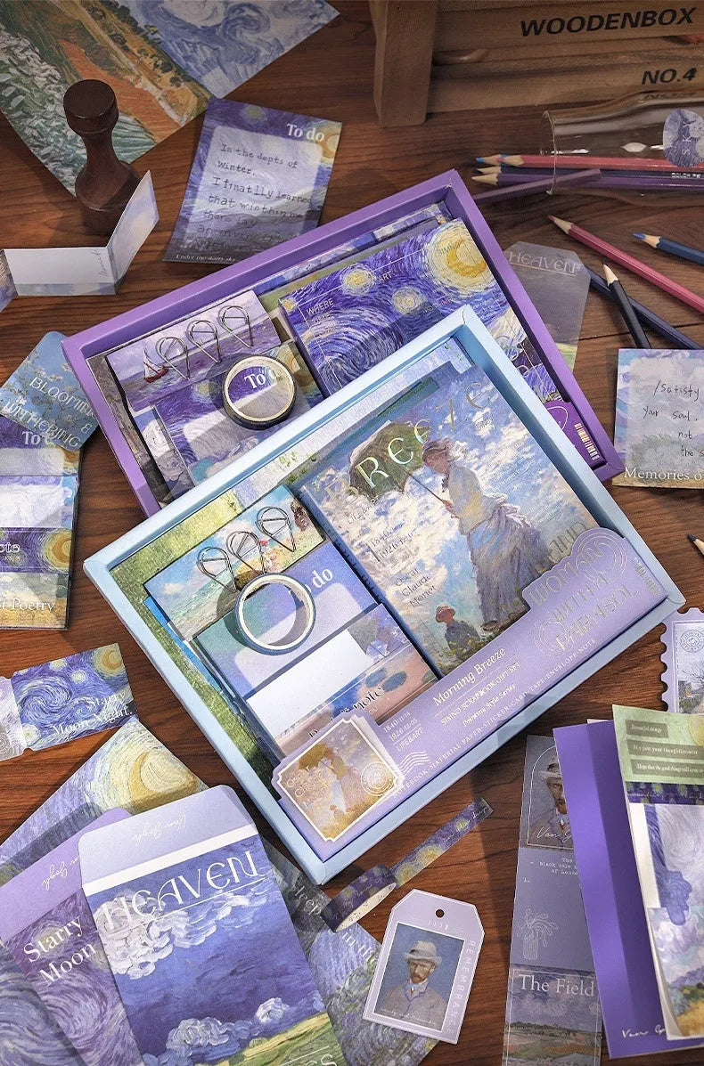 A6 creative journal gift box open to show grid notebook, bookclothes cover, material paper, cards, envelopes, stickers, and a water drop bookmark.