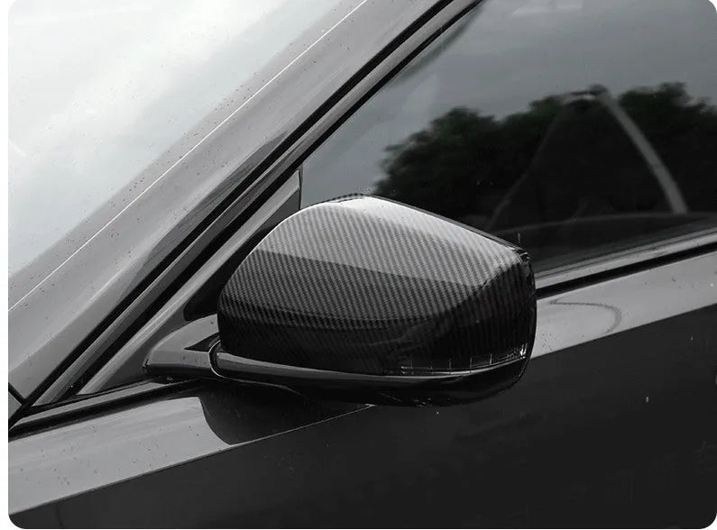 Pair of ABS plastic rearview mirror covers for Cadillac CT5 and CT6 cars in carbon fibre pattern finish.