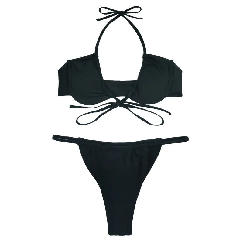 Black and mint green women's two-piece nylon swimsuit bikini set on a white background