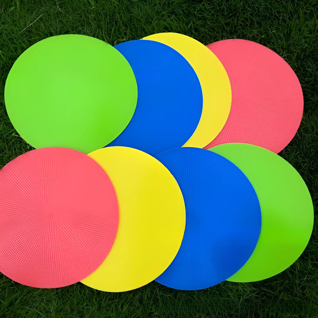 Multi-colour 23 cm diameter soft TPE football training target disc on grass
