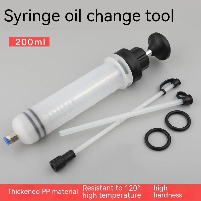 Manual oil pump syringe tool with suction and injection ports for fluid transfer