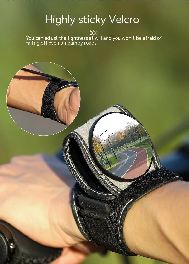 Black nylon cycling wrist rear-view mirror showing strap attachment and mirror positioning
