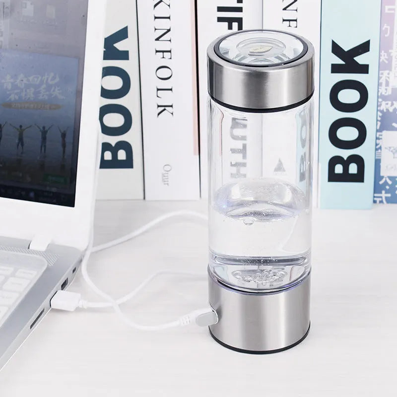 Silver electric hydrogen water generator bottle with borosilicate glass cylindrical design