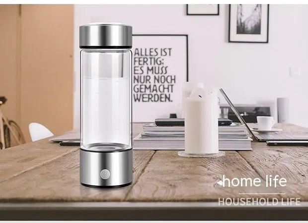 Silver electric hydrogen water generator bottle with borosilicate glass cylindrical design