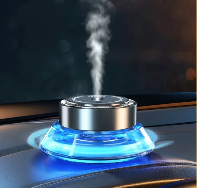 Smart Spray rechargeable car air freshener unit in black or green, with 50ml refill bottles for Ocean and Gulong scents.