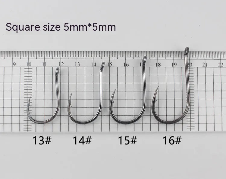 Bulk pack of barbed alloy carbon steel fishing hooks for sea and rock fishing in various sizes.