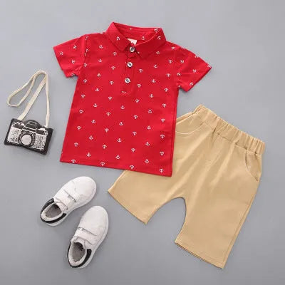 Anchor printed cotton trousers suit set for infants in blue, with short sleeves and pullover closure.