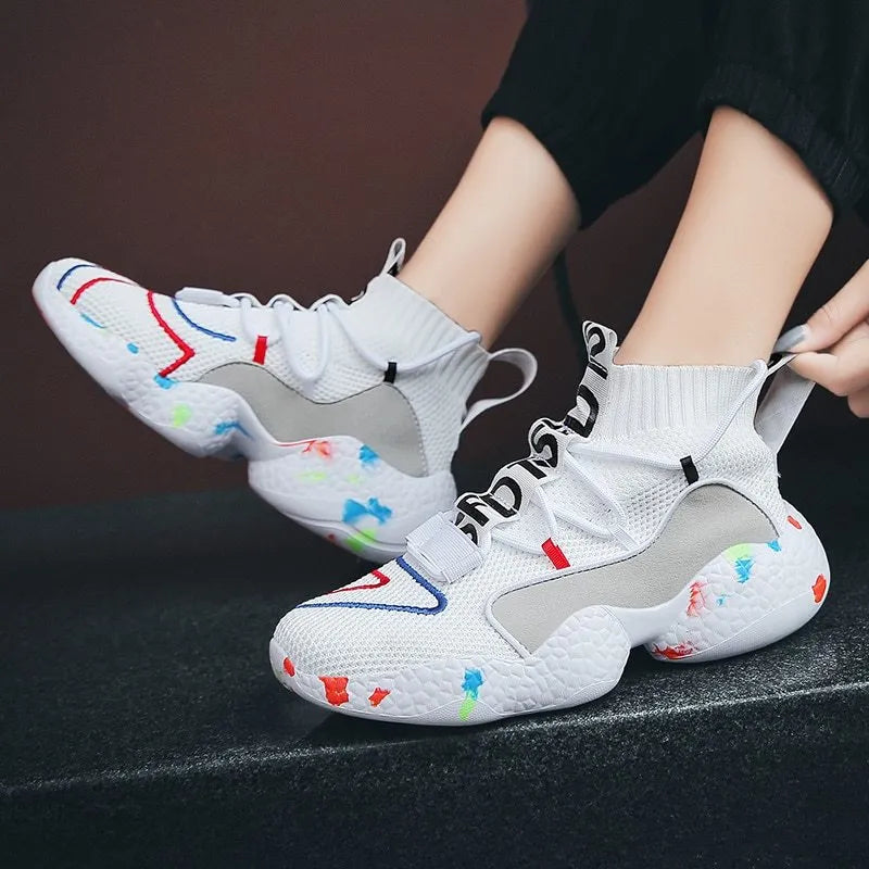 Men's camouflage patterned vulcanised sneakers with mesh upper and flat rubber sole.