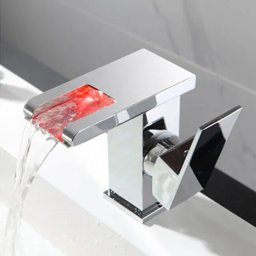 Waterfall basin faucet with chrome finish and induction sensor for hands-free bathroom use