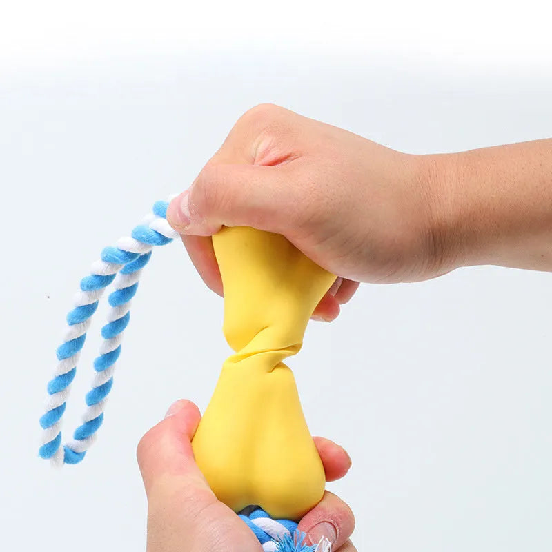 Small green bone-shaped rope knot dog toy with porous openings for treats
