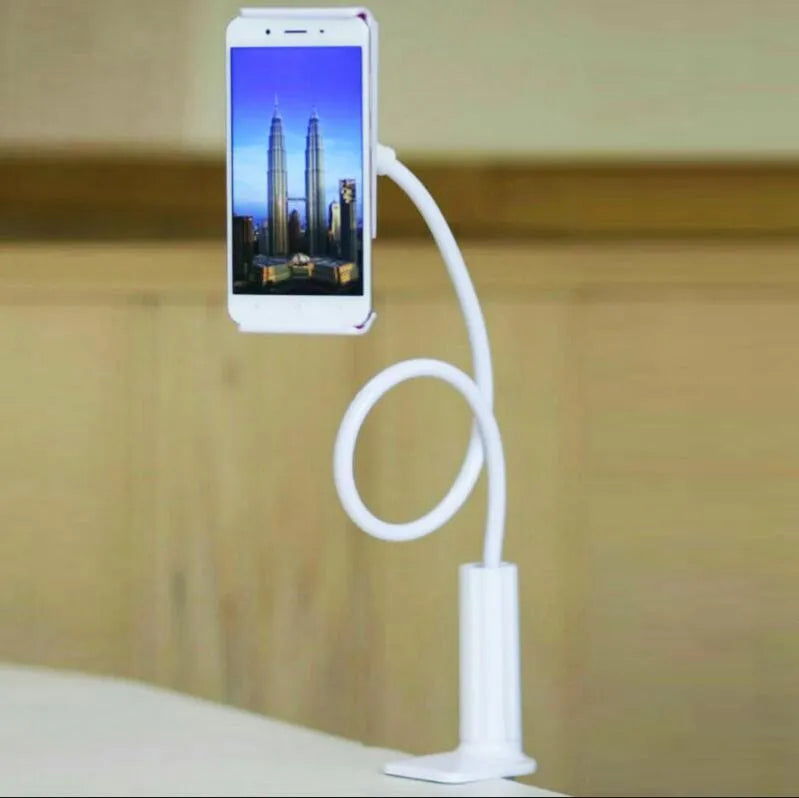 Bedside long-arm mobile phone holder in aluminium alloy and plastic on a table.