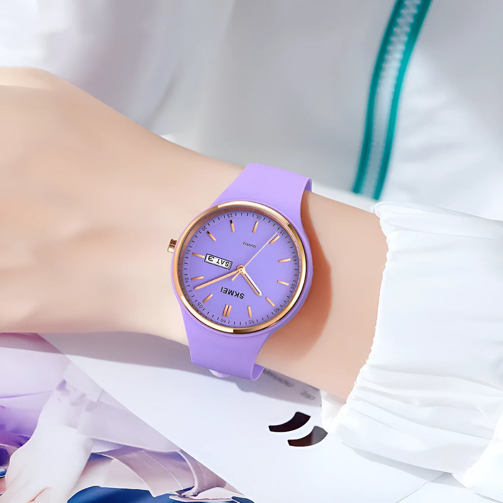 Women's silicone strap quartz watch with calendar, waterproof 30m, on wrist showing 42mm dial.