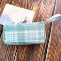 Square canvas stationery storage bag with double-layer design showing striped pattern in six colour grid variations